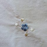 Embroidered blue cluster detail