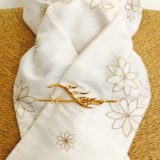 White embroidered honey toned silk stock Pre tied with gold horse's head stock pin