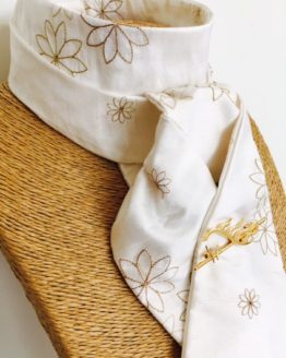 White embroidered honey toned silk stock pre tied with gold horse's head stock pin
