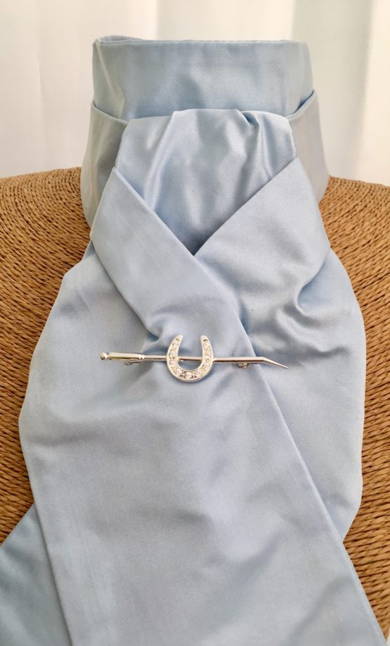 Pale Blue Pure Satin Silk Stock Pre Tied accessorised with our silver horse shoe on a whip stock pin